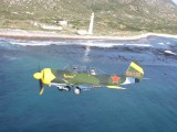 A YAK52 near Slangpunt lighthouse - Cape Town